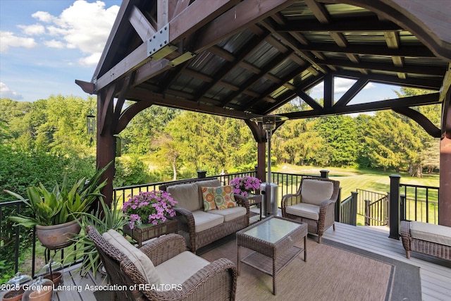 9303 Blueberry Ct, Howell, MI 48843 - deck featuring an outdoor hangout area, a gazebo, and a forest view