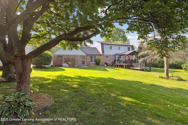 9303 Blueberry Ct, Howell, MI 48843 - view of green lawn featuring a deck