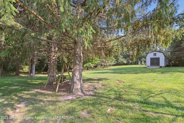 9303 Blueberry Ct, Howell, MI 48843 - view of grassy yard featuring a storage shed