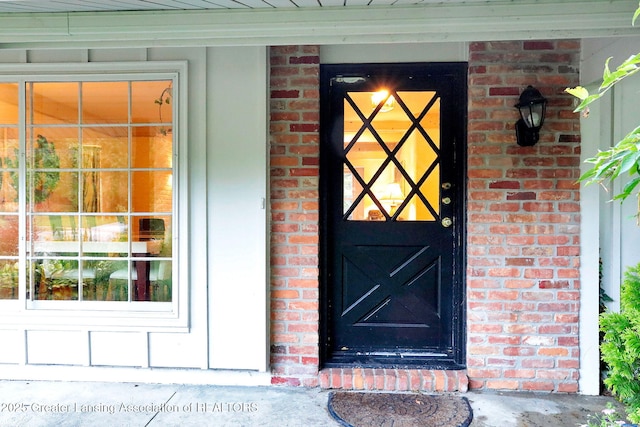 2315 Hamilton Rd, Okemos, MI 48864 - property entrance featuring brick siding