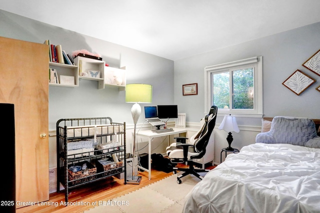 2315 Hamilton Rd, Okemos, MI 48864 - bedroom with wood finished floors and a desk