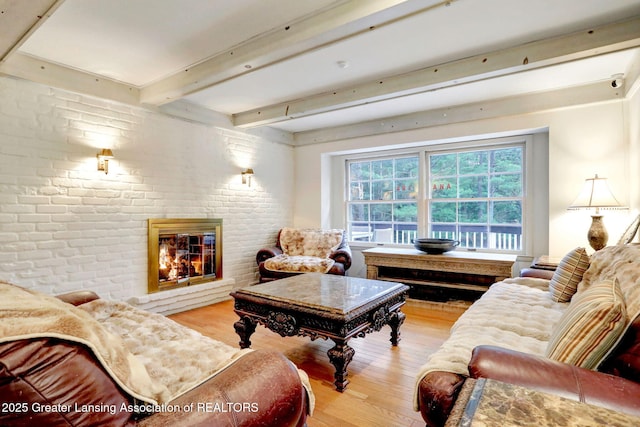 2315 Hamilton Rd, Okemos, MI 48864 - living area with wood finished floors, a fireplace, and beam ceiling