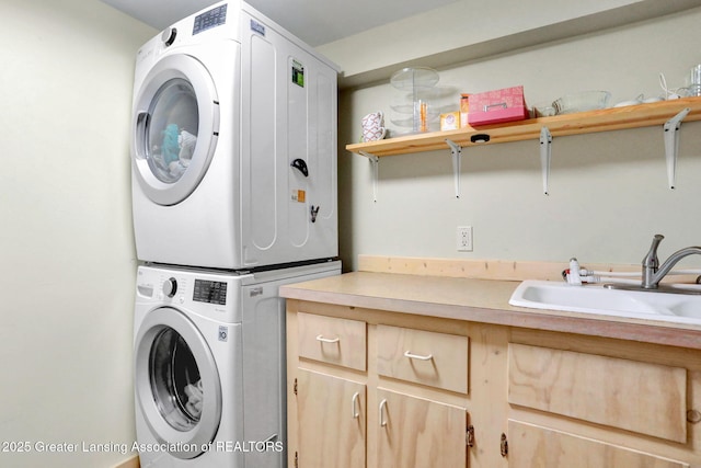 2315 Hamilton Rd, Okemos, MI 48864 - laundry area with stacked washing machine and dryer and cabinet space