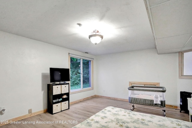 2315 Hamilton Rd, Okemos, MI 48864 - sitting room with wood finished floors and baseboards