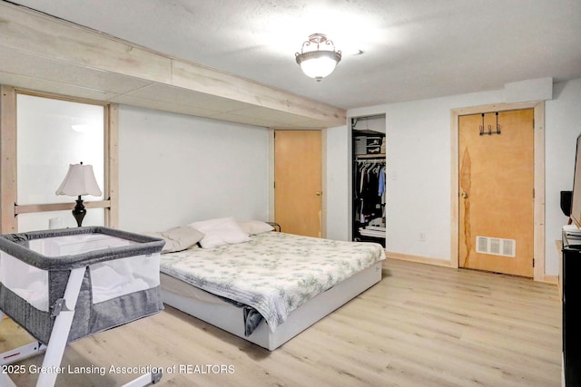 2315 Hamilton Rd, Okemos, MI 48864 - bedroom featuring light wood finished floors and baseboards