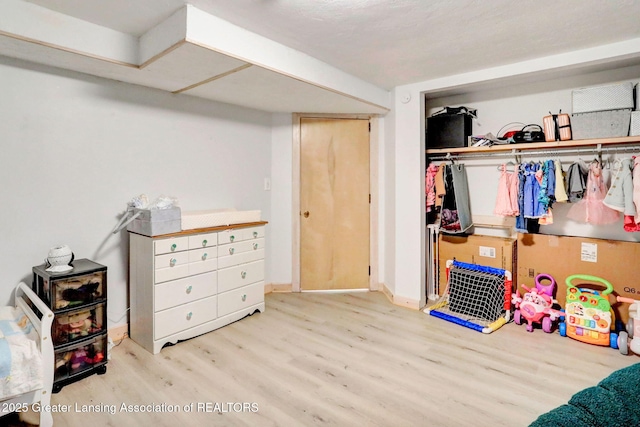 2315 Hamilton Rd, Okemos, MI 48864 - bedroom featuring wood finished floors and a closet