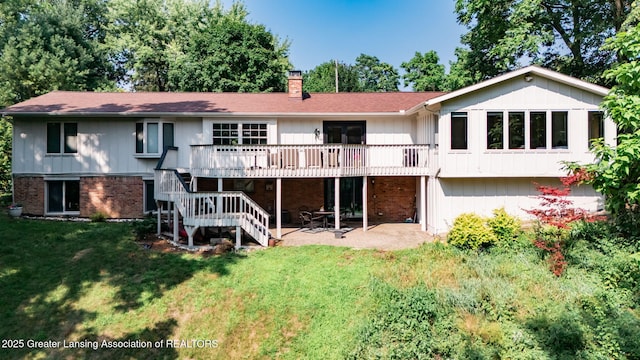 2315 Hamilton Rd, Okemos, MI 48864 - back of house with a patio area, a yard, a deck, a chimney, and stairway
