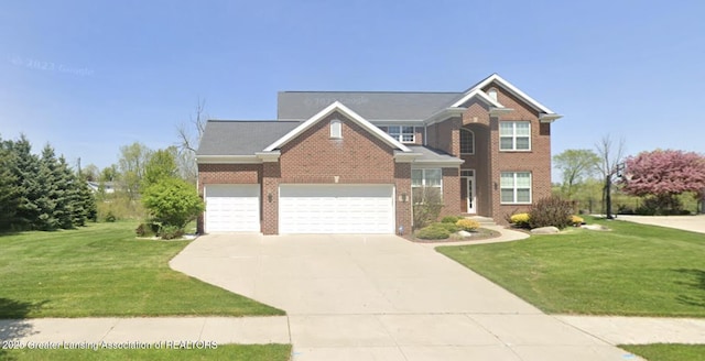 2730 Loon Ln, Okemos, MI 48864 - view of front of house with concrete driveway, a front lawn, brick siding, and a garage