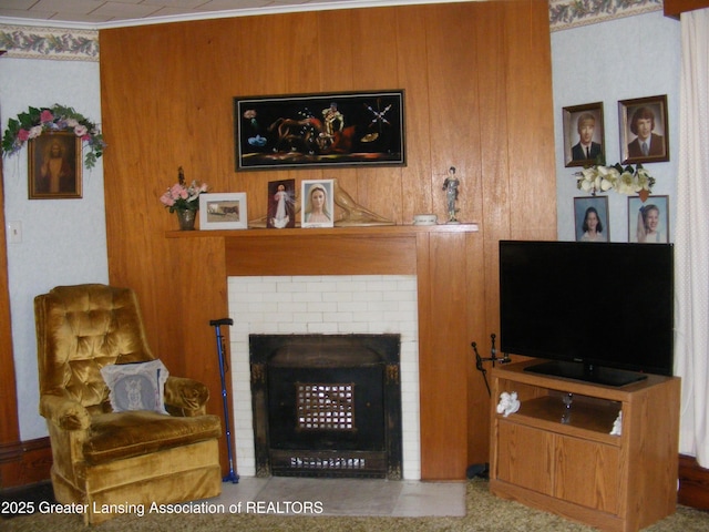 1002 Water St, Eaton Rapids, MI 48827 - living area featuring a brick fireplace and wooden walls
