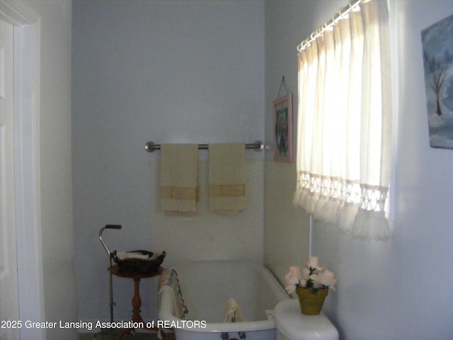 1002 Water St, Eaton Rapids, MI 48827 - full bath featuring a tub to relax in and toilet