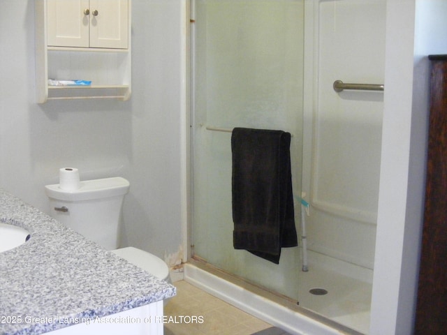 1002 Water St, Eaton Rapids, MI 48827 - full bathroom with a shower stall, vanity, and tile patterned flooring