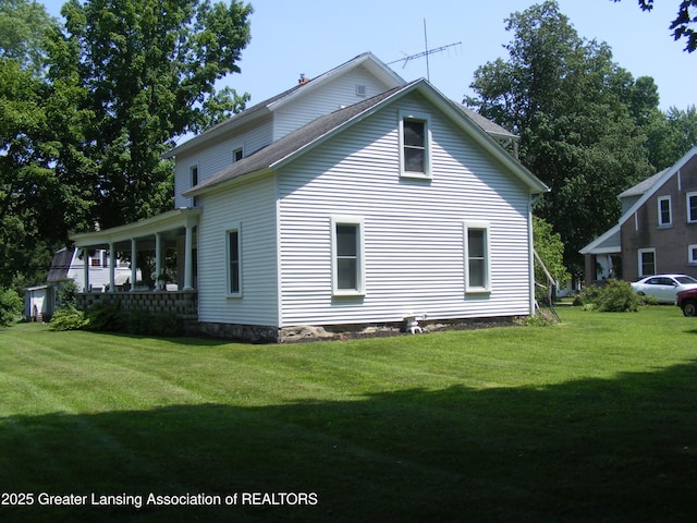 1002 Water St, Eaton Rapids, MI 48827 - view of home's exterior featuring a yard