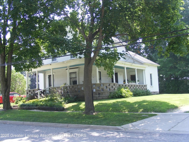 1002 Water St, Eaton Rapids, MI 48827 - view of front of house with covered porch and a front yard