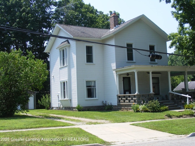 1002 Water St, Eaton Rapids, MI 48827 - view of front facade featuring a porch, a chimney, a front yard, and roof with shingles
