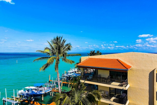property view of water featuring a boat dock and boat lift