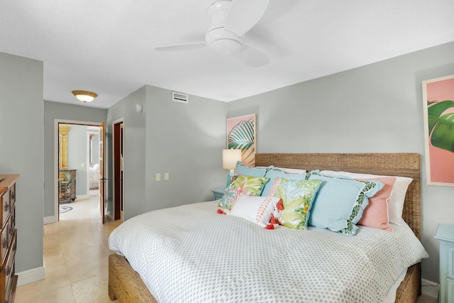 bedroom with visible vents, baseboards, and a ceiling fan