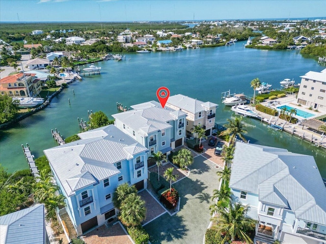 bird's eye view with a water view and a residential view