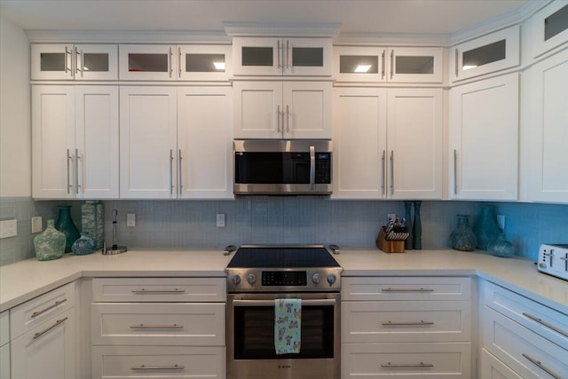 kitchen featuring white cabinetry, light countertops, and appliances with stainless steel finishes
