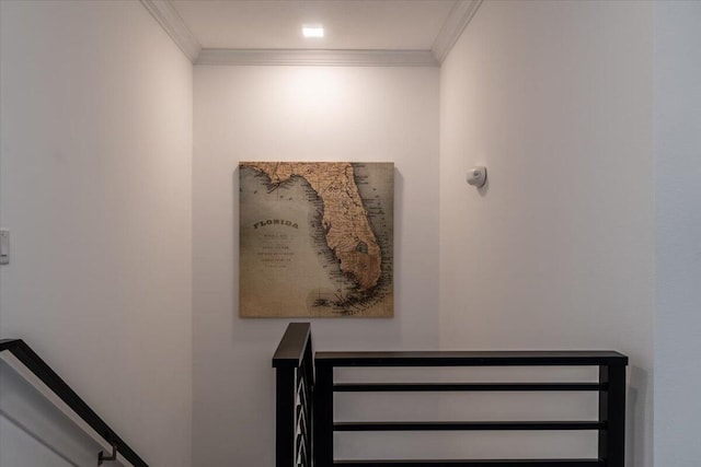 staircase featuring crown molding