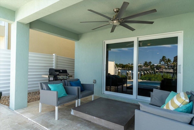 view of patio with grilling area, an outdoor hangout area, and ceiling fan