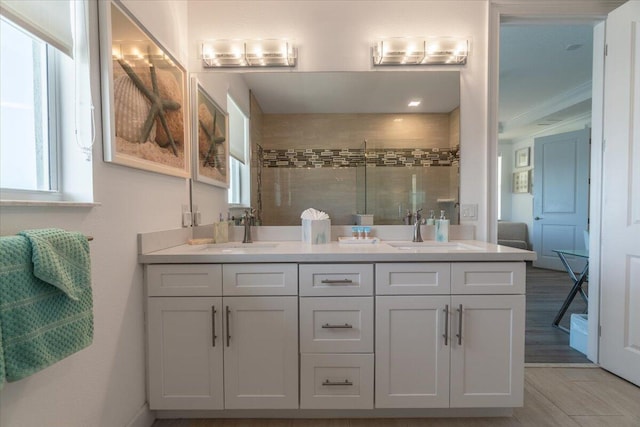 full bathroom featuring a sink, plenty of natural light, and a stall shower