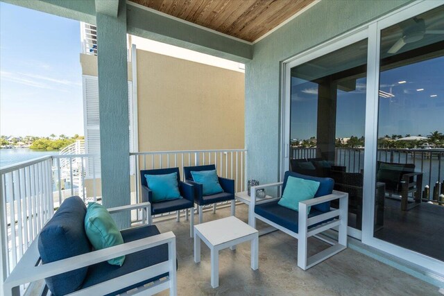 balcony featuring a water view