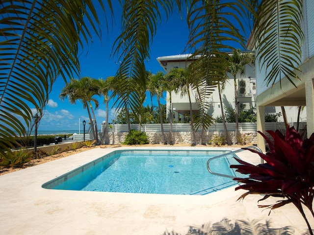 view of swimming pool featuring a fenced in pool and a fenced backyard