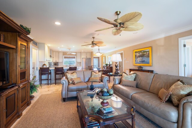 living room with ceiling fan, crown molding, and recessed lighting
