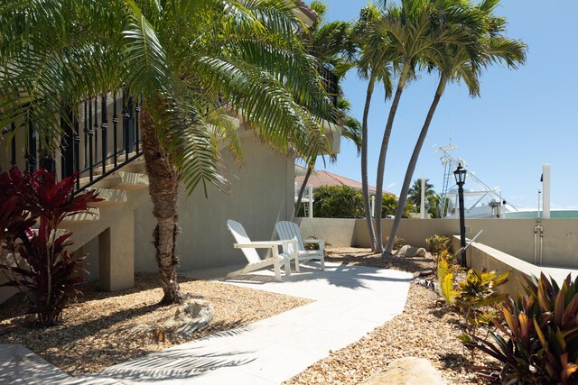 view of patio featuring fence