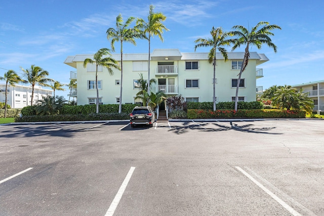 view of property with uncovered parking