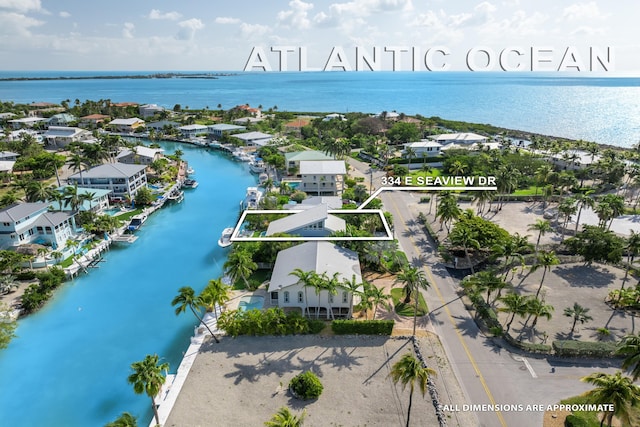 bird's eye view with a residential view and a water view