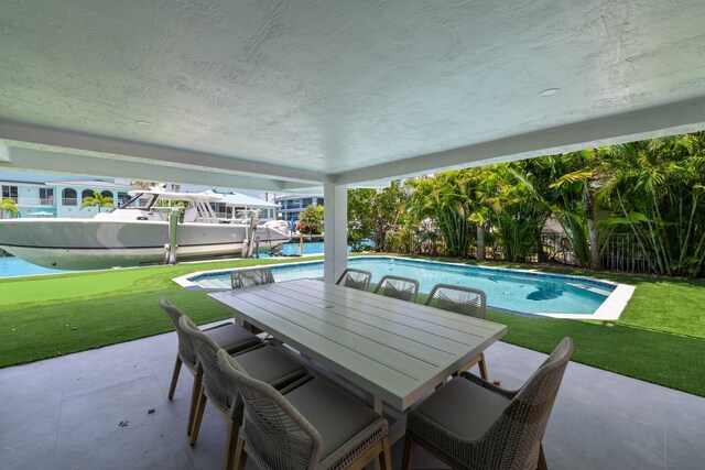 view of patio featuring an outdoor pool and outdoor dining space
