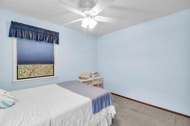 bedroom featuring carpet flooring, baseboards, and ceiling fan