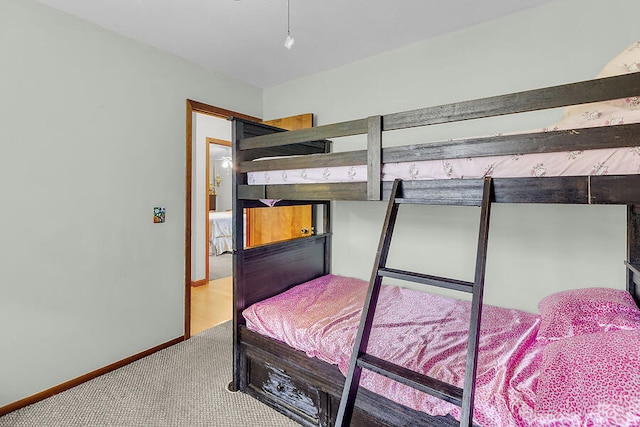 carpeted bedroom with baseboards