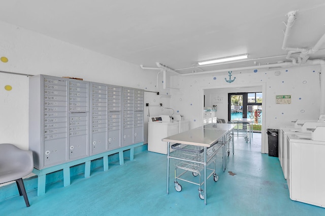 interior space featuring mail area and separate washer and dryer