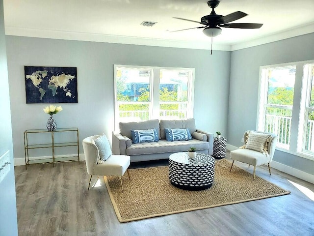 231 Pelican Ln, Big Pine, FL 33043 - sitting room featuring crown molding, a ceiling fan, wood finished floors, baseboards, and visible vents