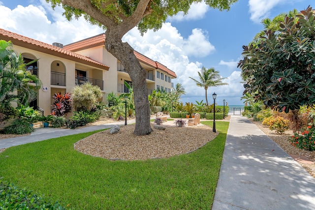 view of property's community with a yard