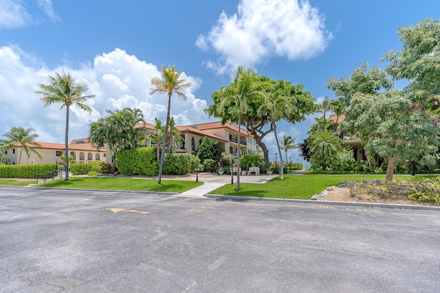 mediterranean / spanish-style home featuring stucco siding and a front lawn