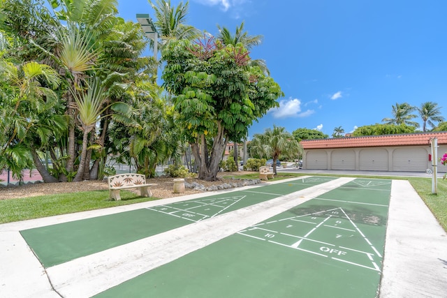 view of home's community featuring shuffleboard