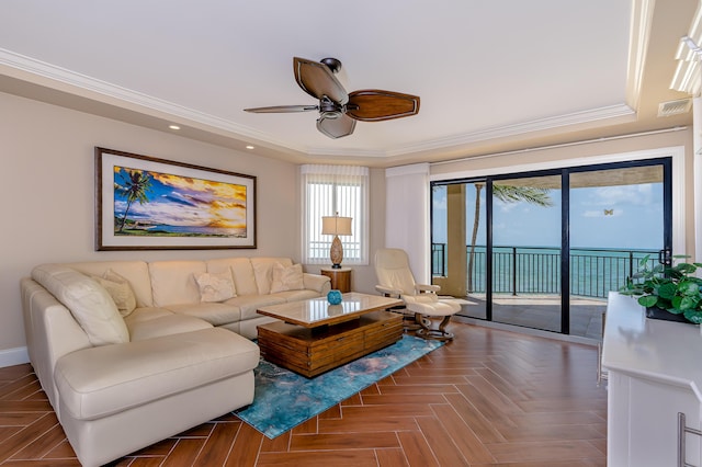 living area featuring recessed lighting, a ceiling fan, crown molding, visible vents, and a tray ceiling