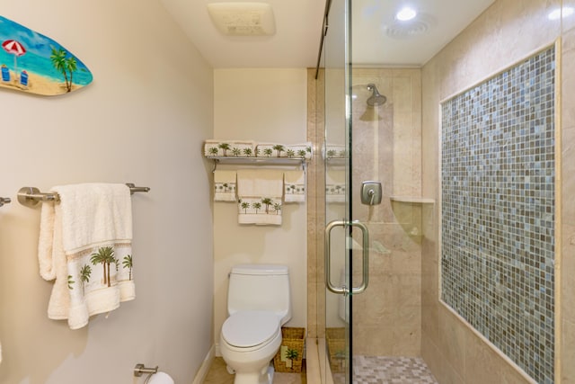 bathroom with toilet and a stall shower