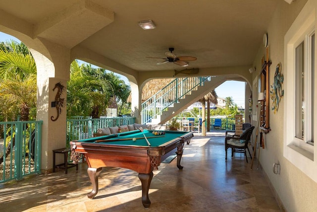 recreation room with baseboards, a ceiling fan, and pool table