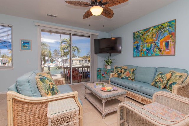 461 3rd St, Key Colony, FL 33051 - living area featuring ceiling fan, light tile patterned flooring, healthy amount of natural light, and baseboards