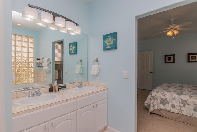 461 3rd St, Key Colony, FL 33051 - full bath with tile patterned floors, double vanity, a ceiling fan, and a garden tub