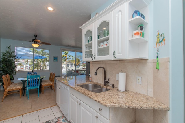 461 3rd St, Key Colony, FL 33051 - kitchen with a sink, ceiling fan, dishwasher, light stone countertops, and light tile patterned flooring
