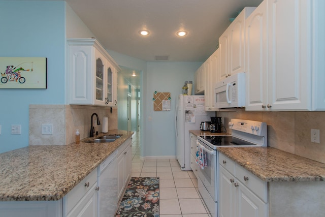 461 3rd St, Key Colony, FL 33051 - kitchen featuring white appliances, a sink, tasteful backsplash, glass insert cabinets, and light tile patterned floors