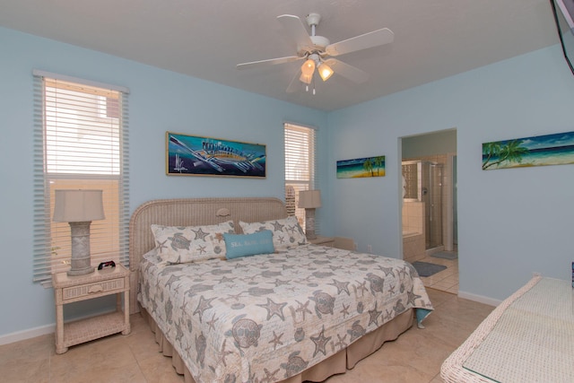 461 3rd St, Key Colony, FL 33051 - tiled bedroom featuring baseboards, ceiling fan, and ensuite bathroom