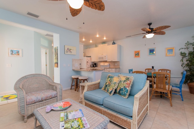 461 3rd St, Key Colony, FL 33051 - living room featuring a ceiling fan, light tile patterned floors, and baseboards