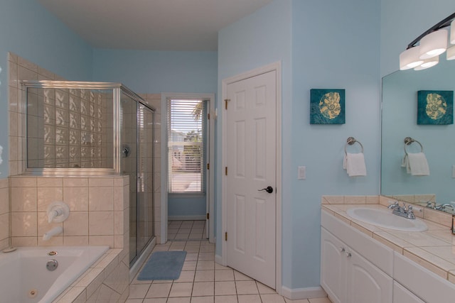 461 3rd St, Key Colony, FL 33051 - bathroom with a shower stall, a whirlpool tub, vanity, tile patterned flooring, and baseboards