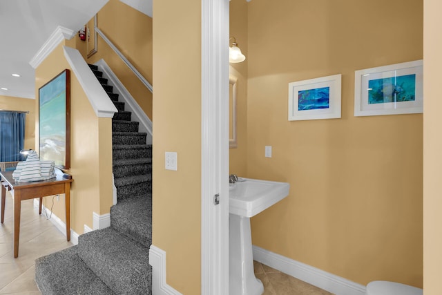 staircase featuring recessed lighting, tile patterned flooring, and baseboards